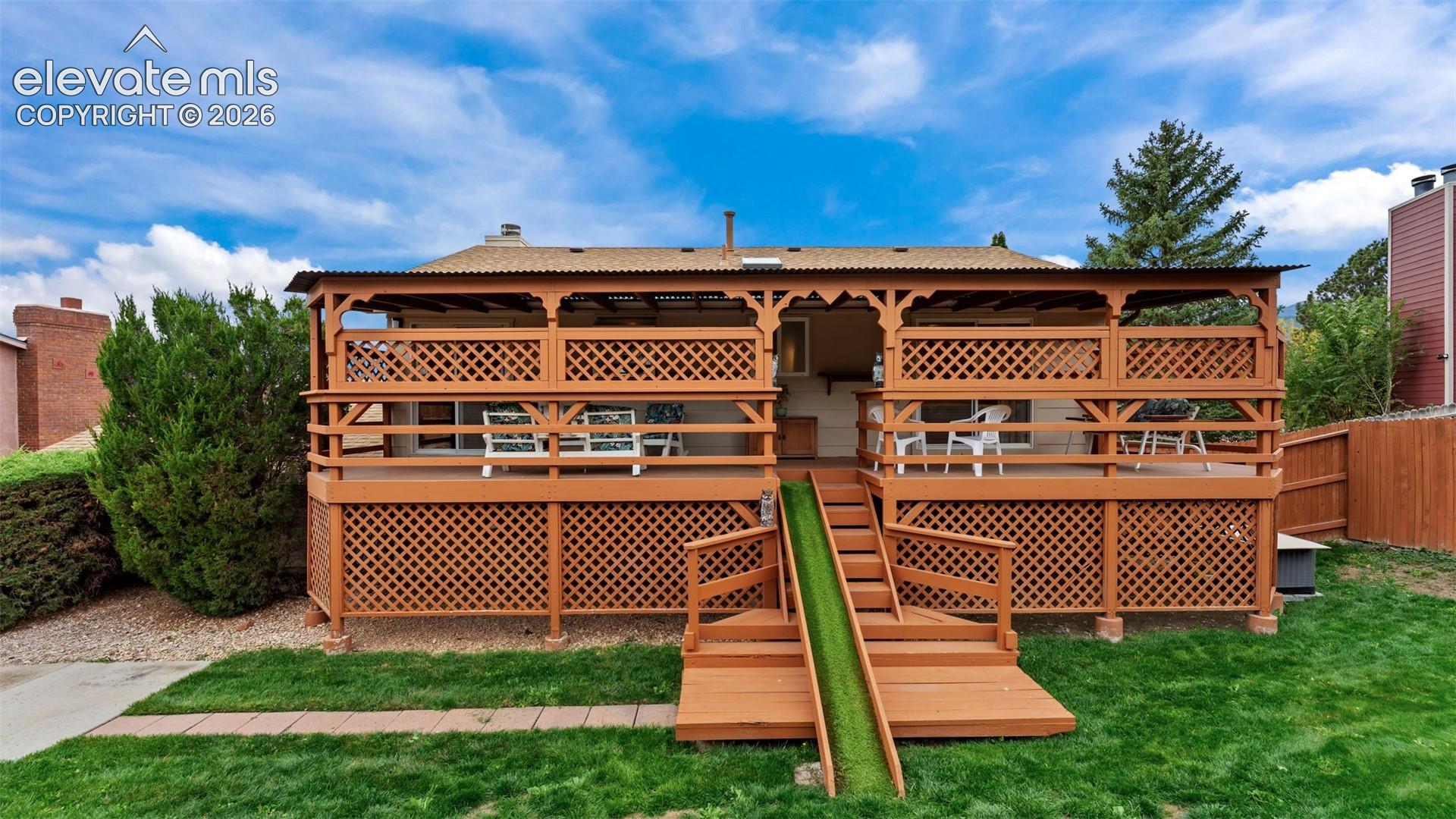 Large back covered deck on the back of the home