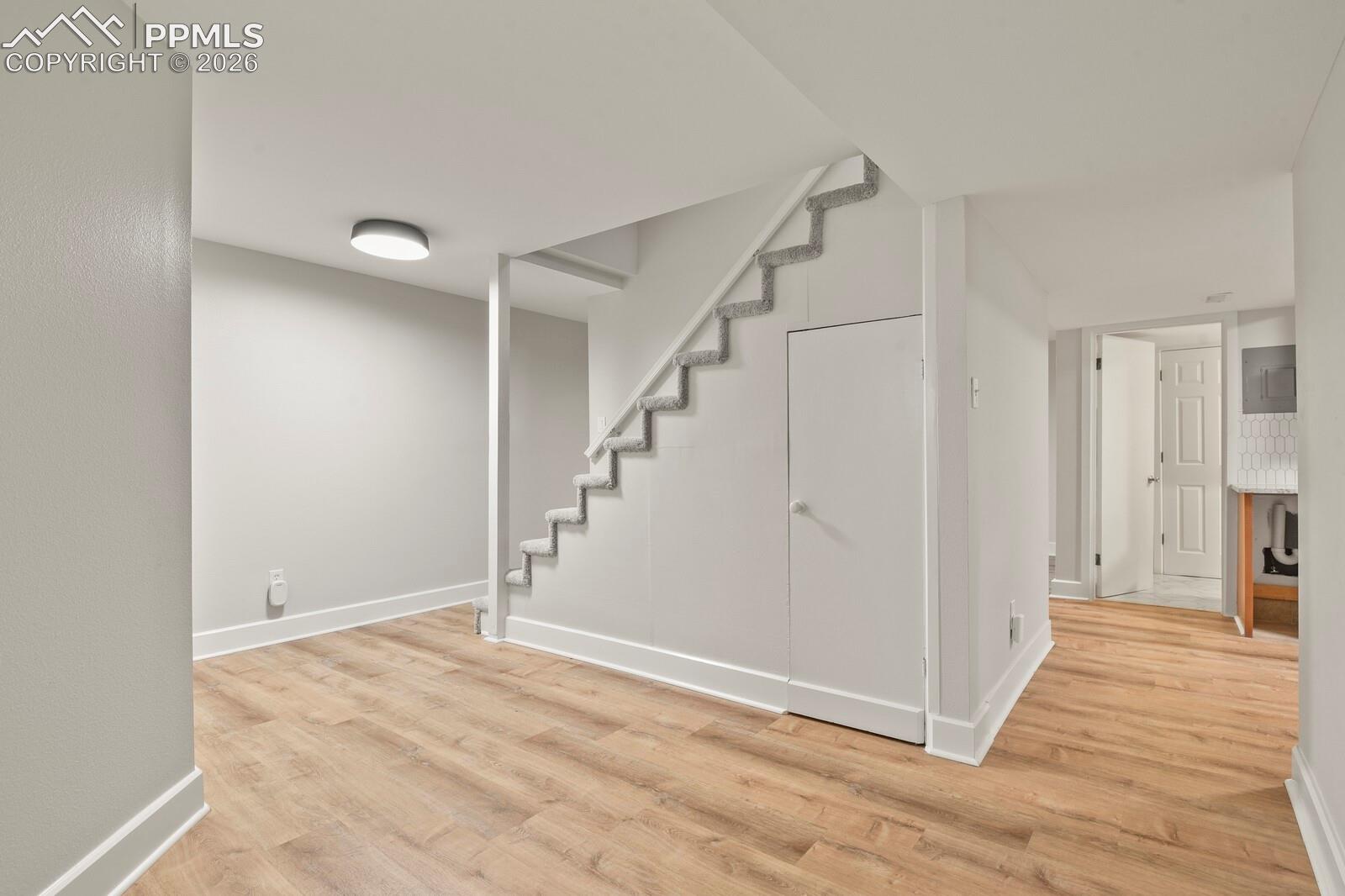 Basement living area featuring LVP flooring 