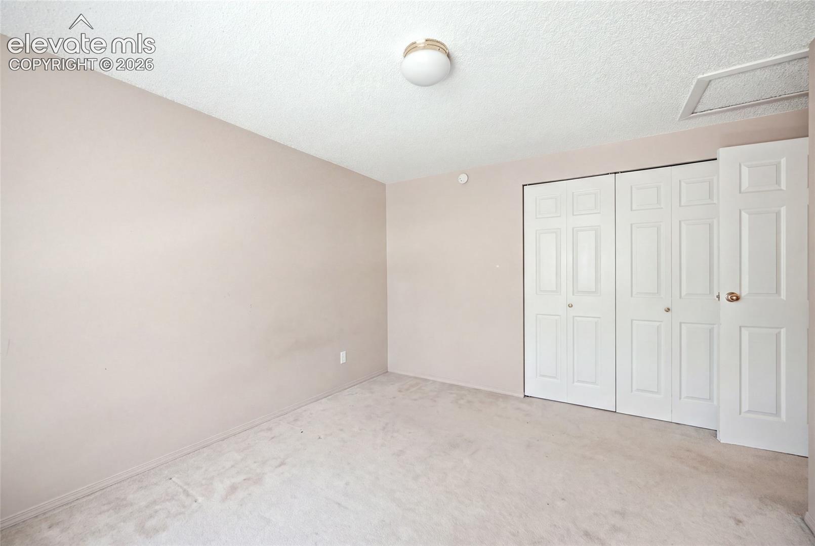 Upper level bedroom.  AI removed items from bedroom.  This picture may not be representative of room's current condition.