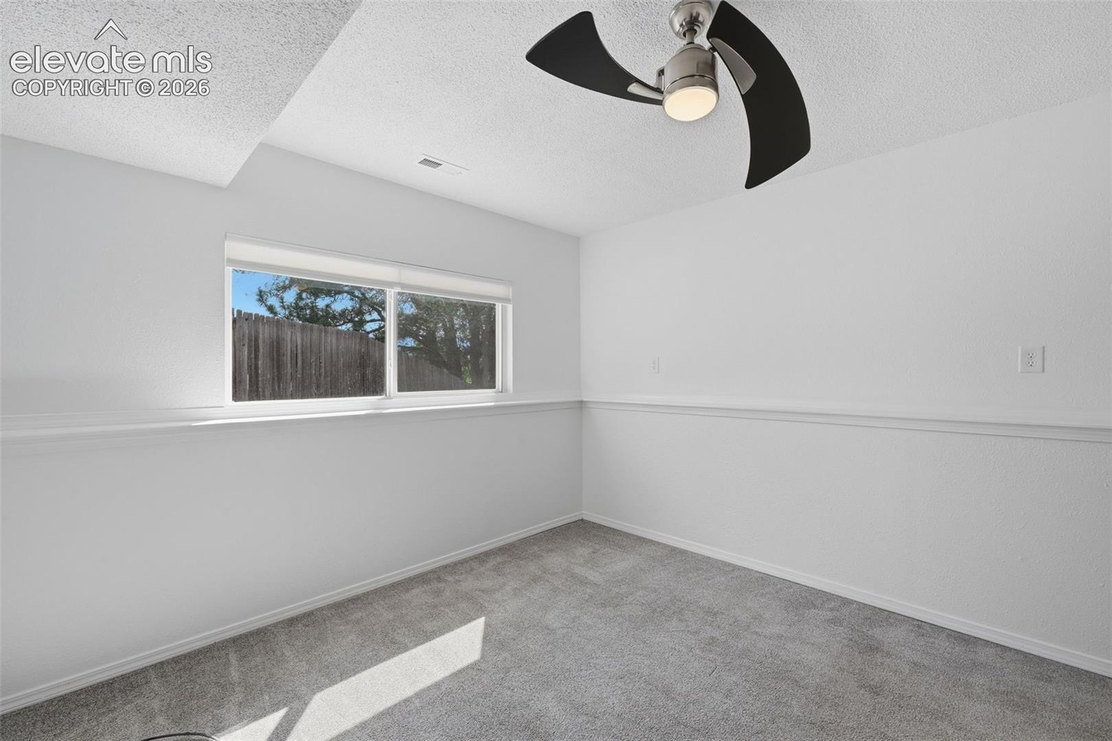 Basement bedroom to the left of the stairs, garden level so light filled with walk in closet