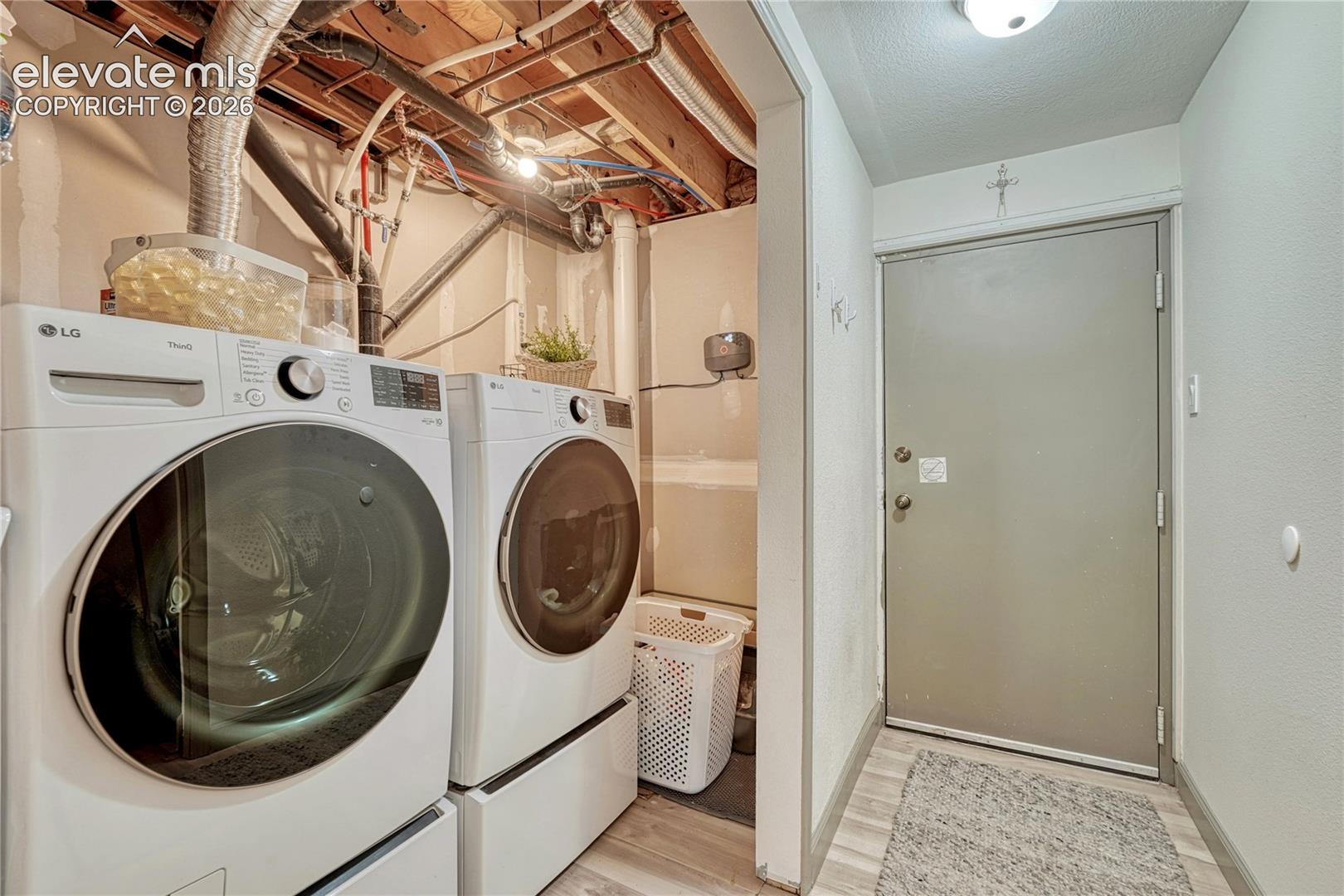 Lower level laundry room with utility sink
