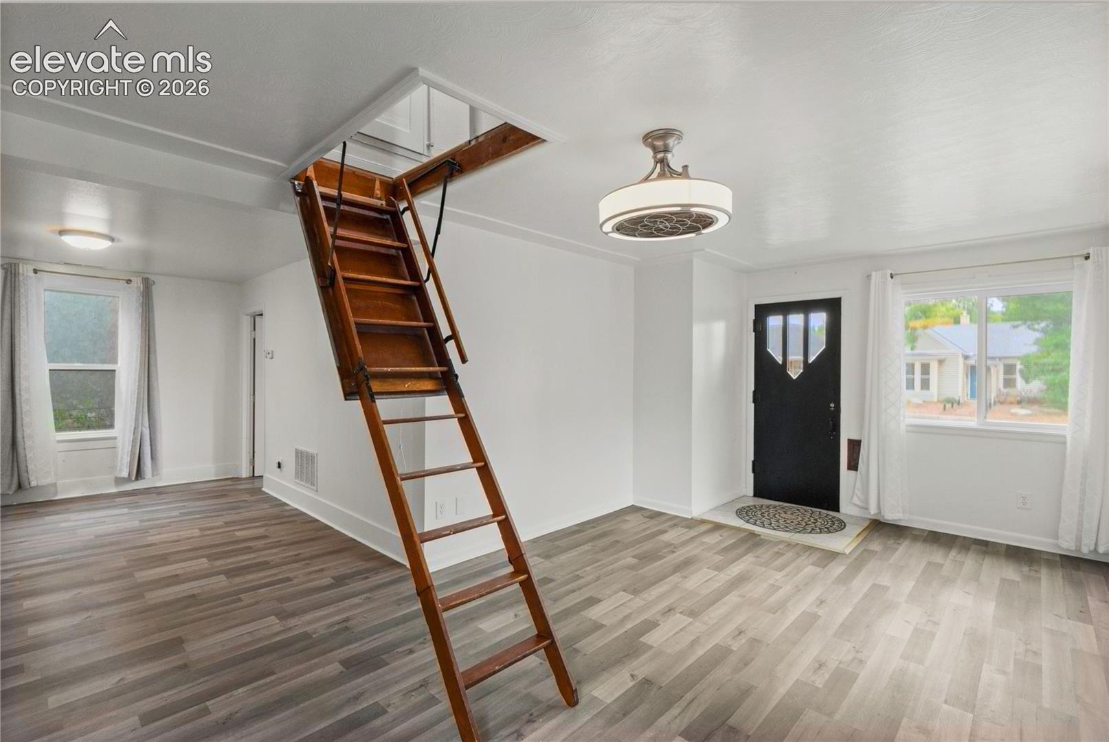 Living Room and Entry showing loft access