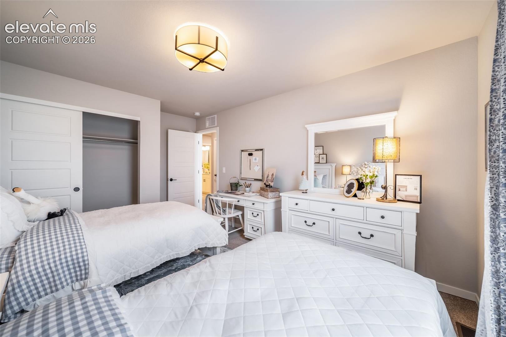 Bright bedroom featuring neutral wall tones
*Photos of a model home*