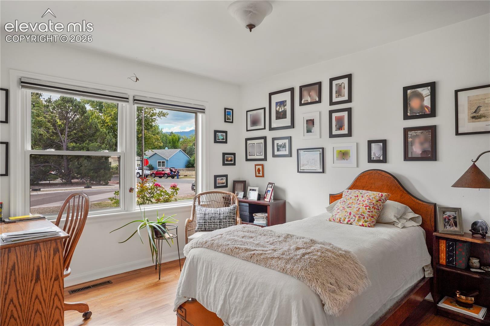 Front Bedroom with big windows and hardwood floors