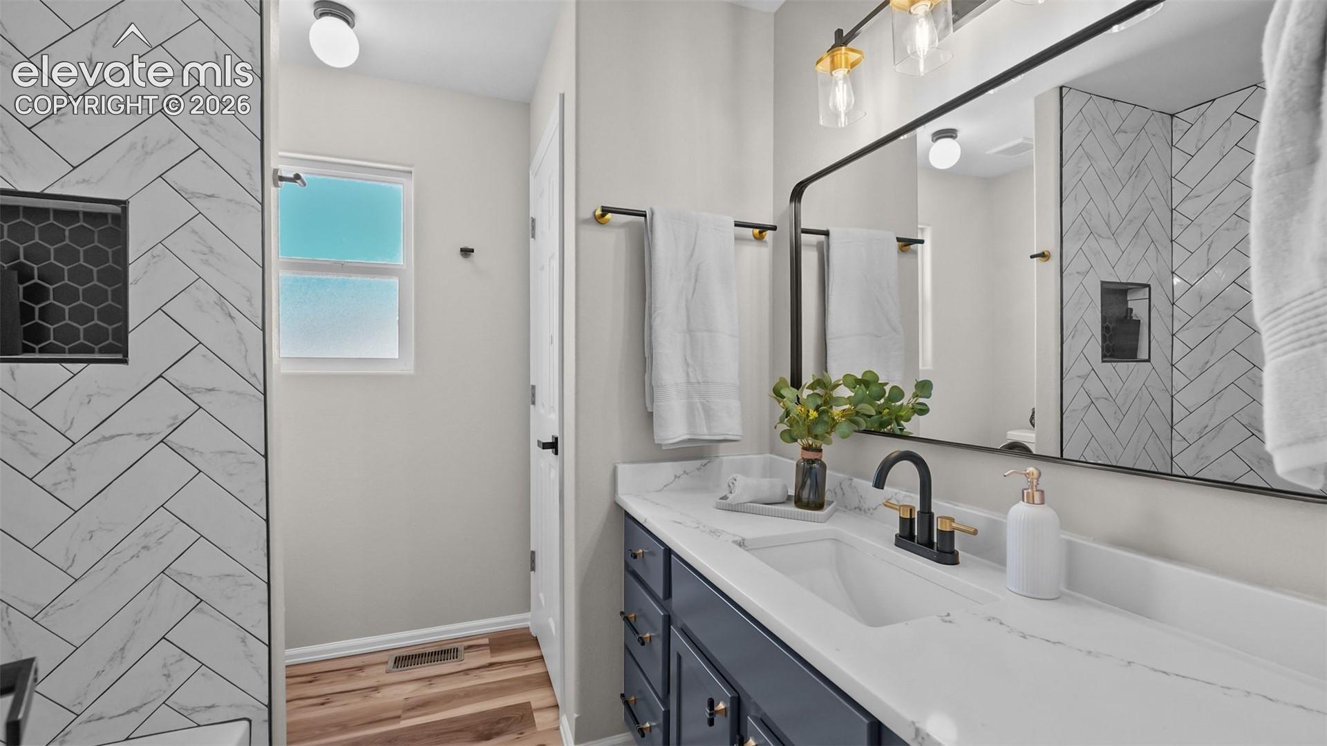 White countertop with integrated sink and matte black faucet