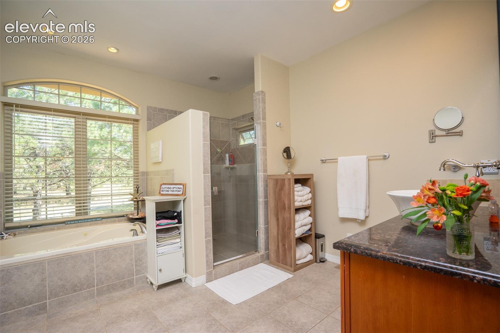 Need a little pampering? This Primary bath offers 2 separate sinks, a jetted tub, and an oversized spa-like shower