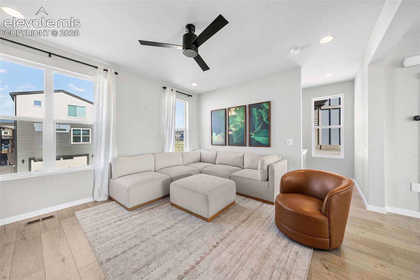 The living room is bright and spacious. With engineered wood floors, large windows and plenty of room for seating, this is a space you will love relaxing in every day. 