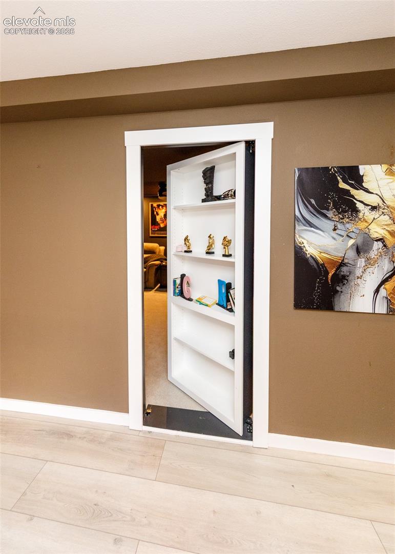 Hidden Bookshelf Entrance to Theatre Room