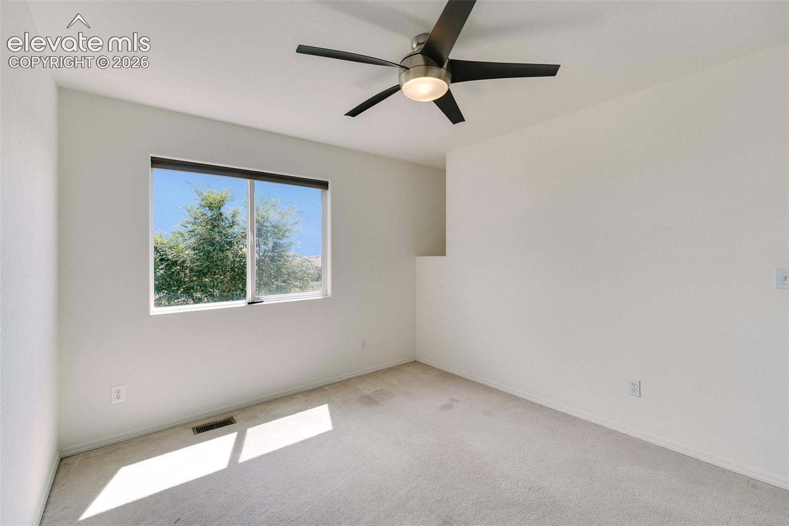 Vaulted ceiling with an integrated ceiling fan and light fixture