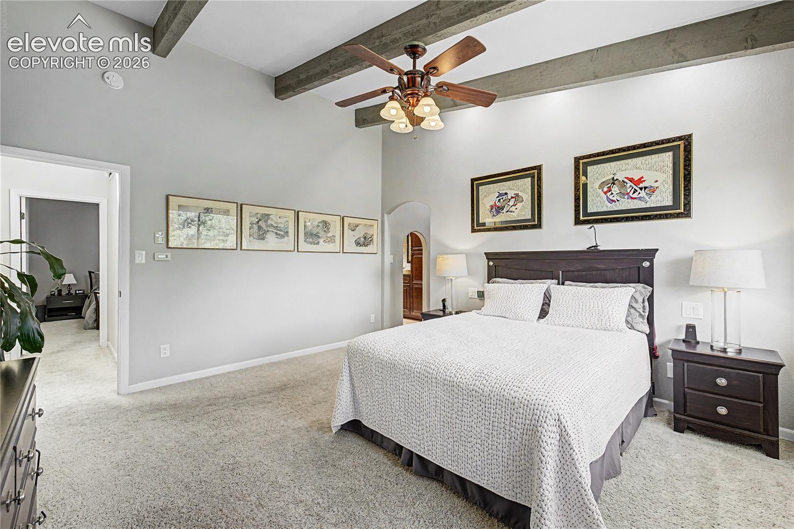 The abundantly sized primary suite showcases the seamless way of life this home provides.