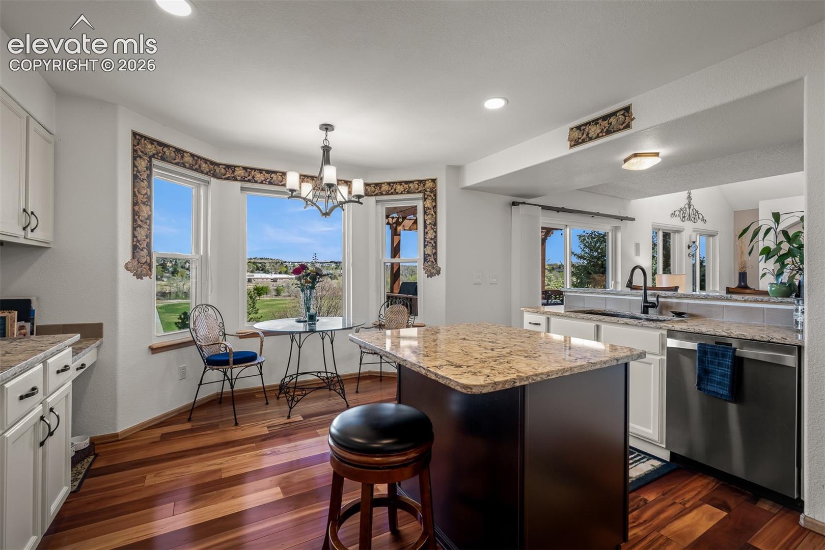 Great picture of kitchen & breakfast area featuring  the natural light.