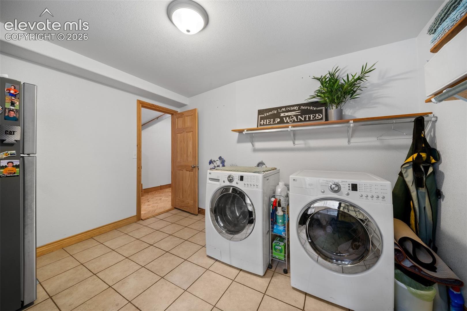 Basement laundry room with additional storage space