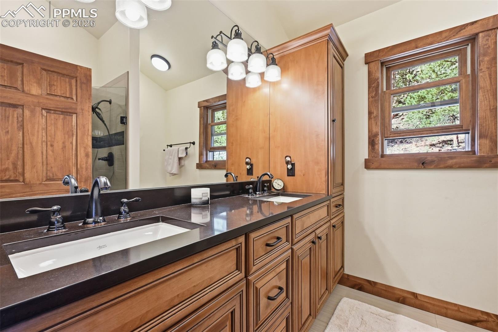 The primary retreat offers dual sinks and tons of storage and countertop space.