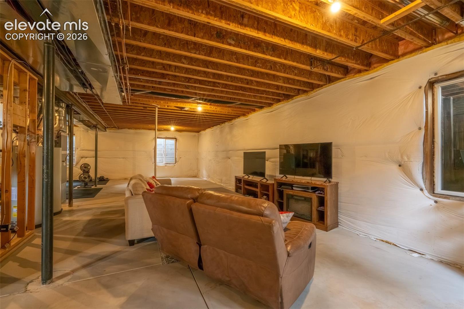 Unfinished nearly 1600 sq ft basement with multiple window egress 