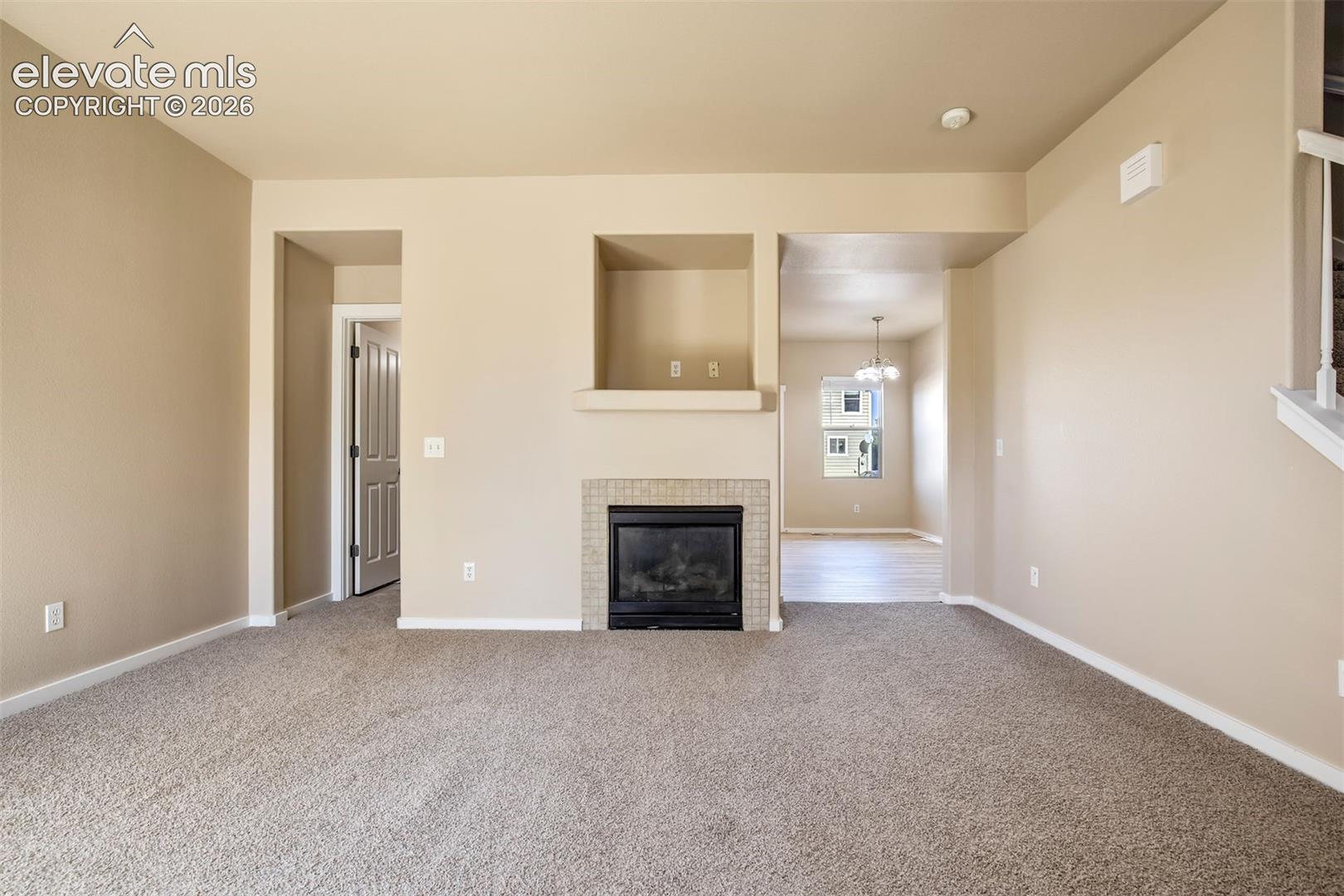 Living Room is open to kitchen and there is a 1/2 bath hidden away from kitchen