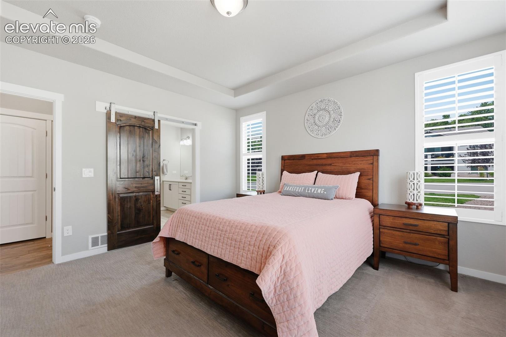 Tray ceiling with recessed lighting.