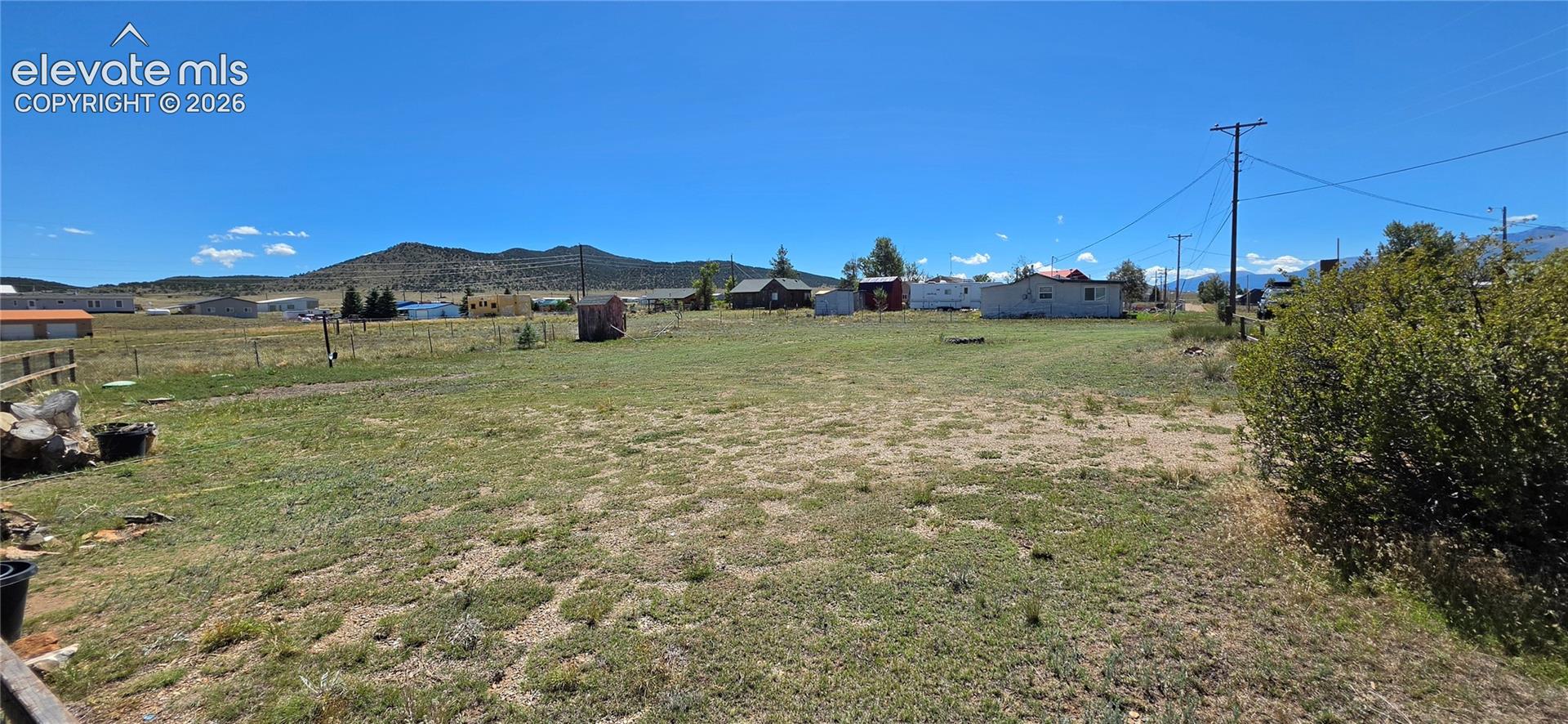 Expansive open lot with distant mountain scenery
