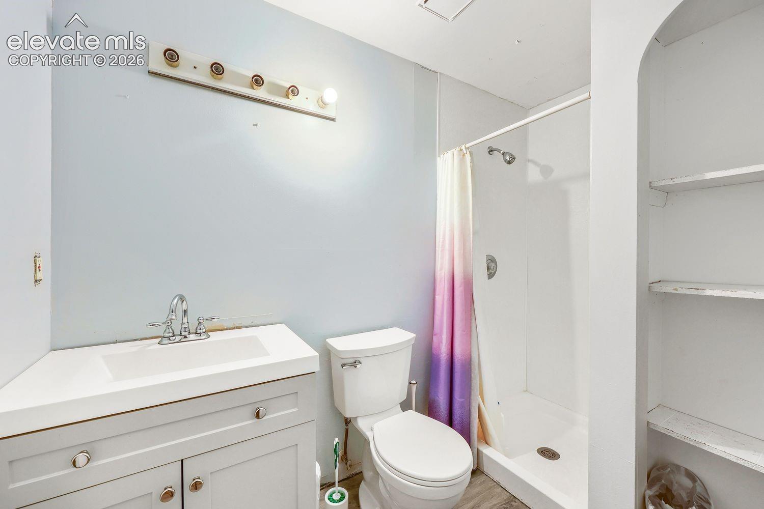 Corner vanity with integrated rectangular sink and chrome faucet