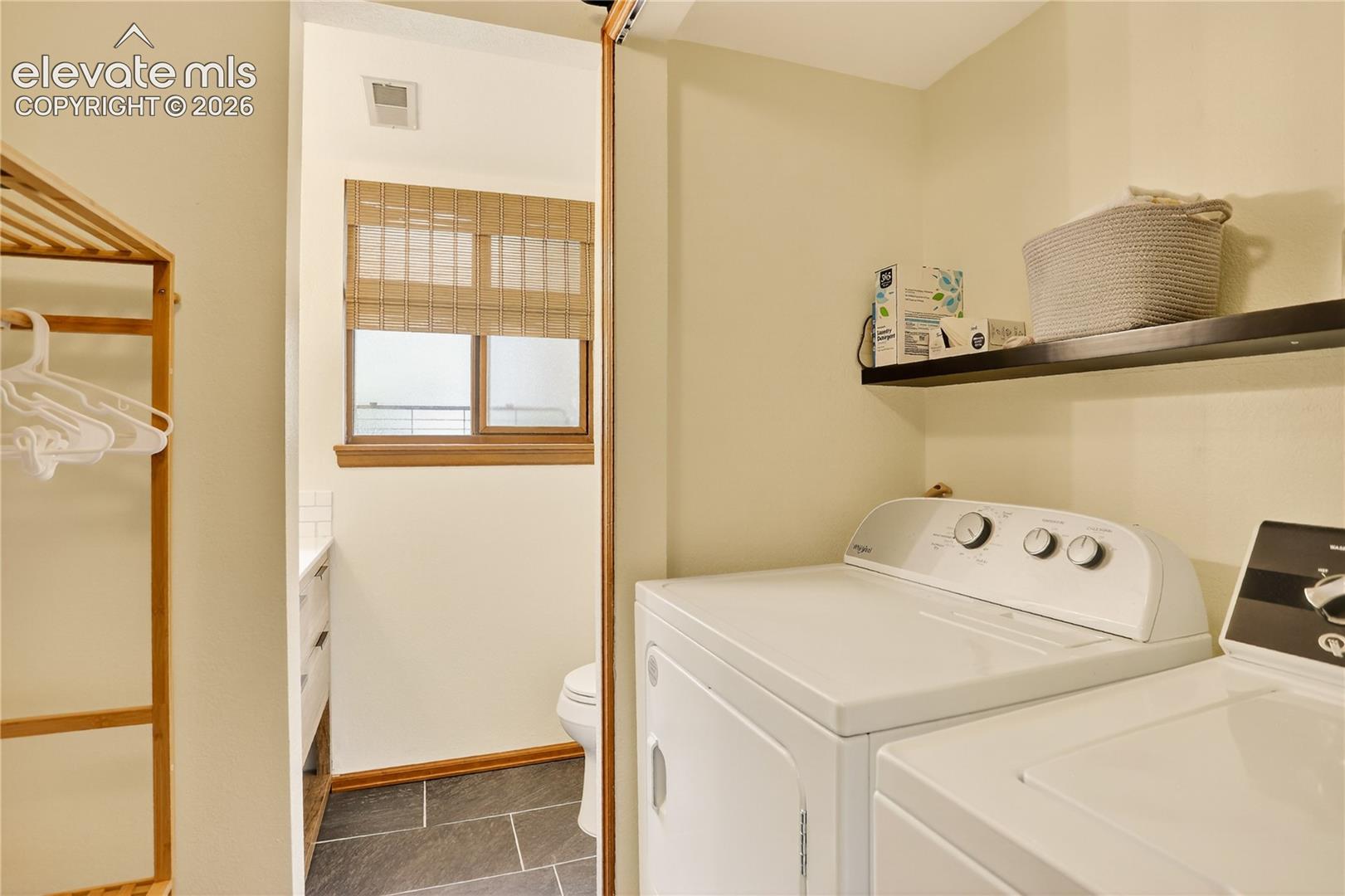 Lower level powder room & laundry space