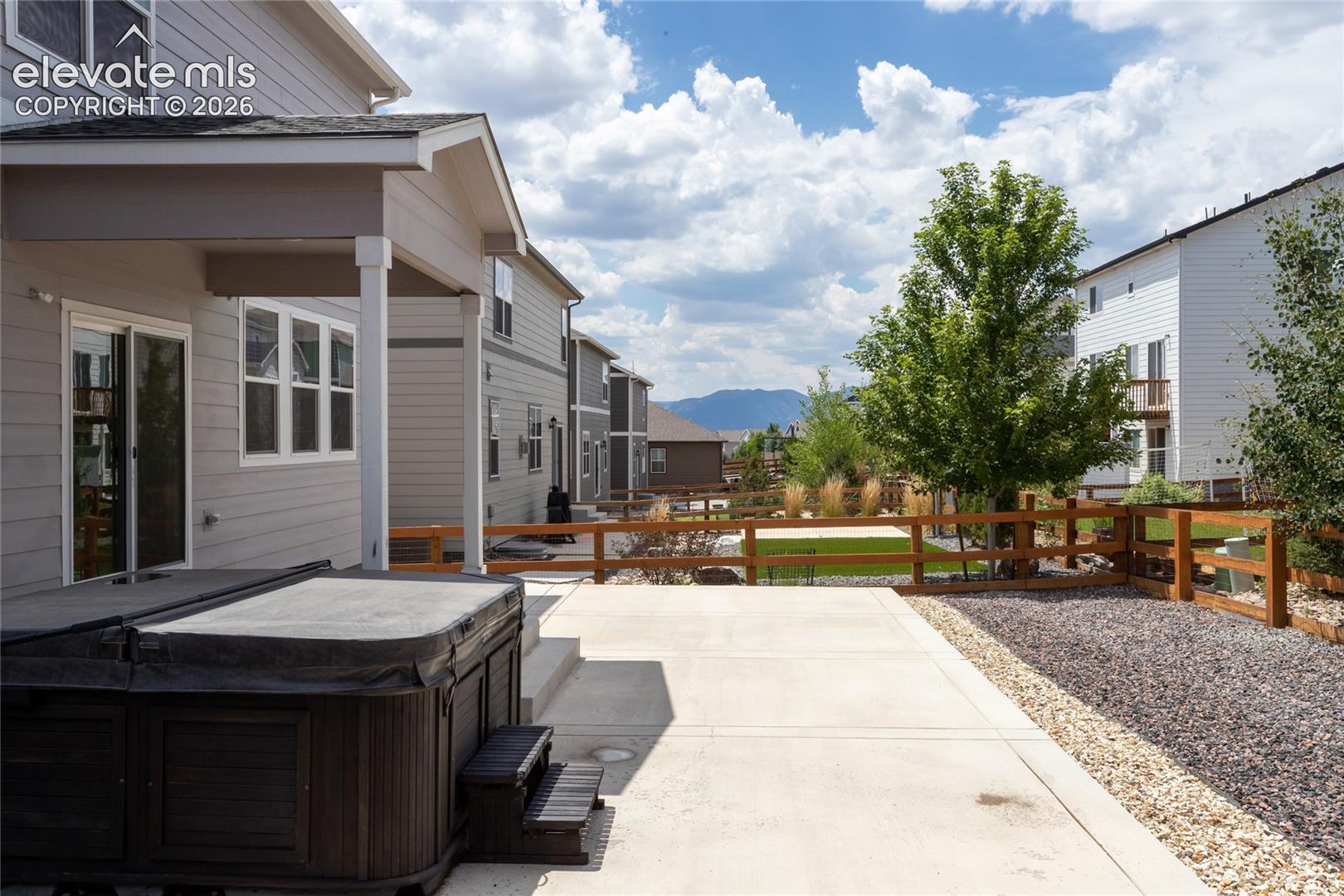 Expanded, partially covered patio with mountain views is perfect for outdoor living and entertaining!