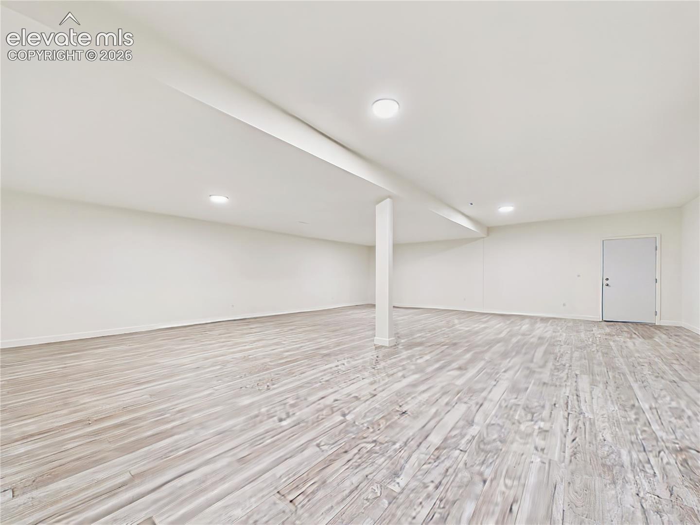 Finished Basement – This additional perspective showcases the expansive finished basement, clean neutral palette, recessed lighting, and flexible floor space for recreation, media, or entertaining.