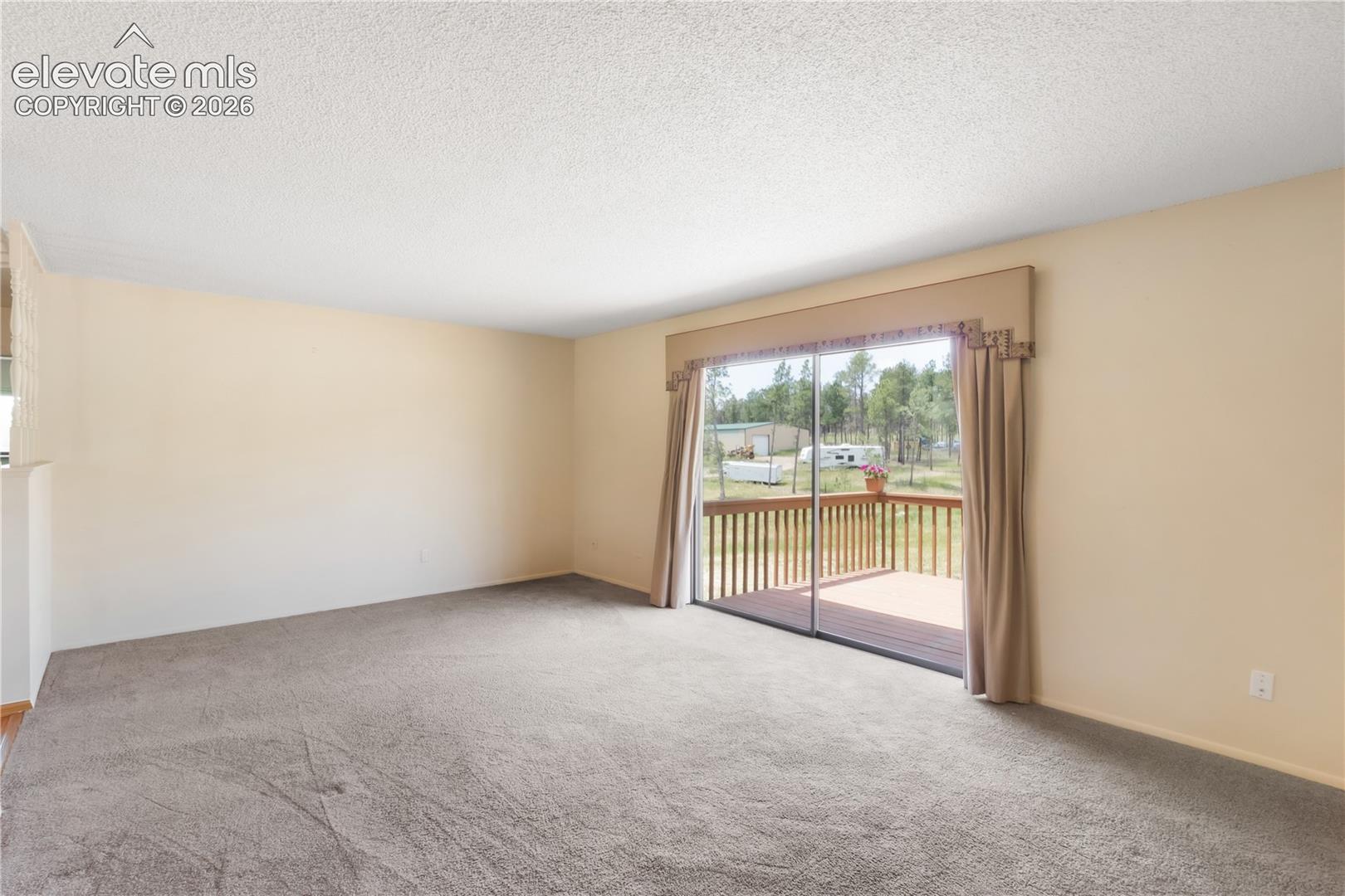 Living room with doors to deck