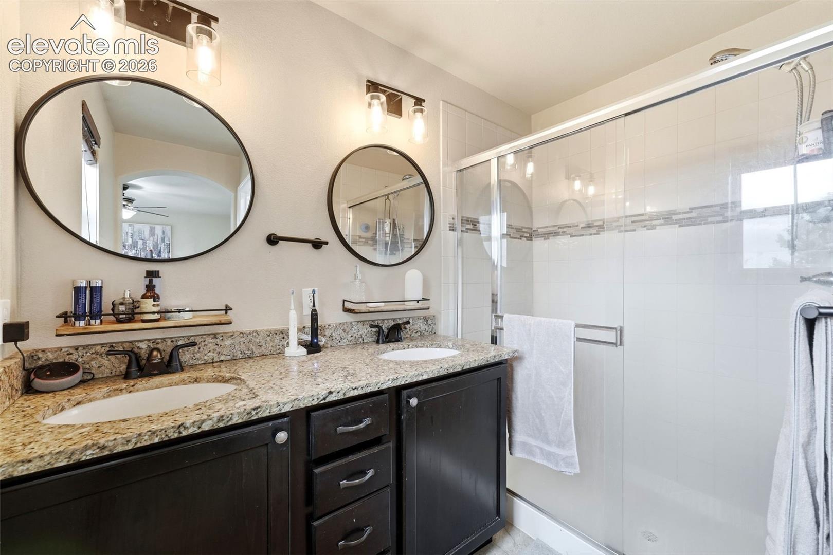 Dual vanity with granite countertops and undermount sinks