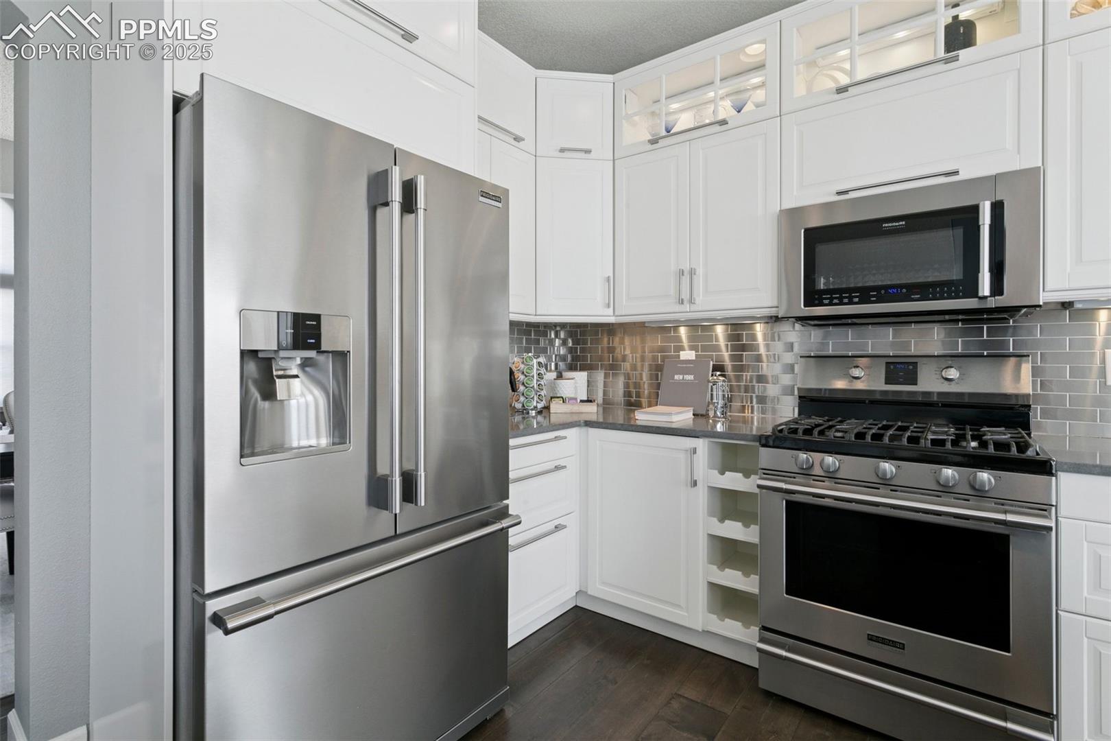 Lighted upper cabinets, beverage storage, beautiful stainless appliances!
