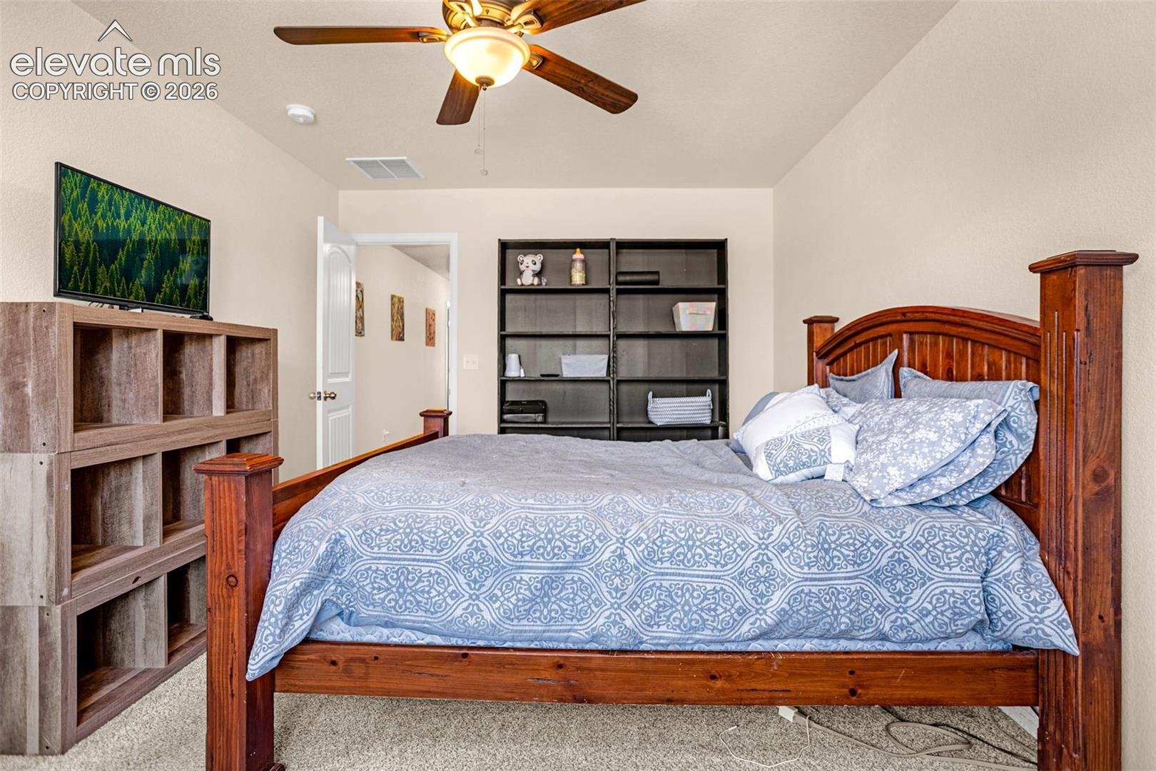 Recessed lighting, ceiling fan, and light-colored walls