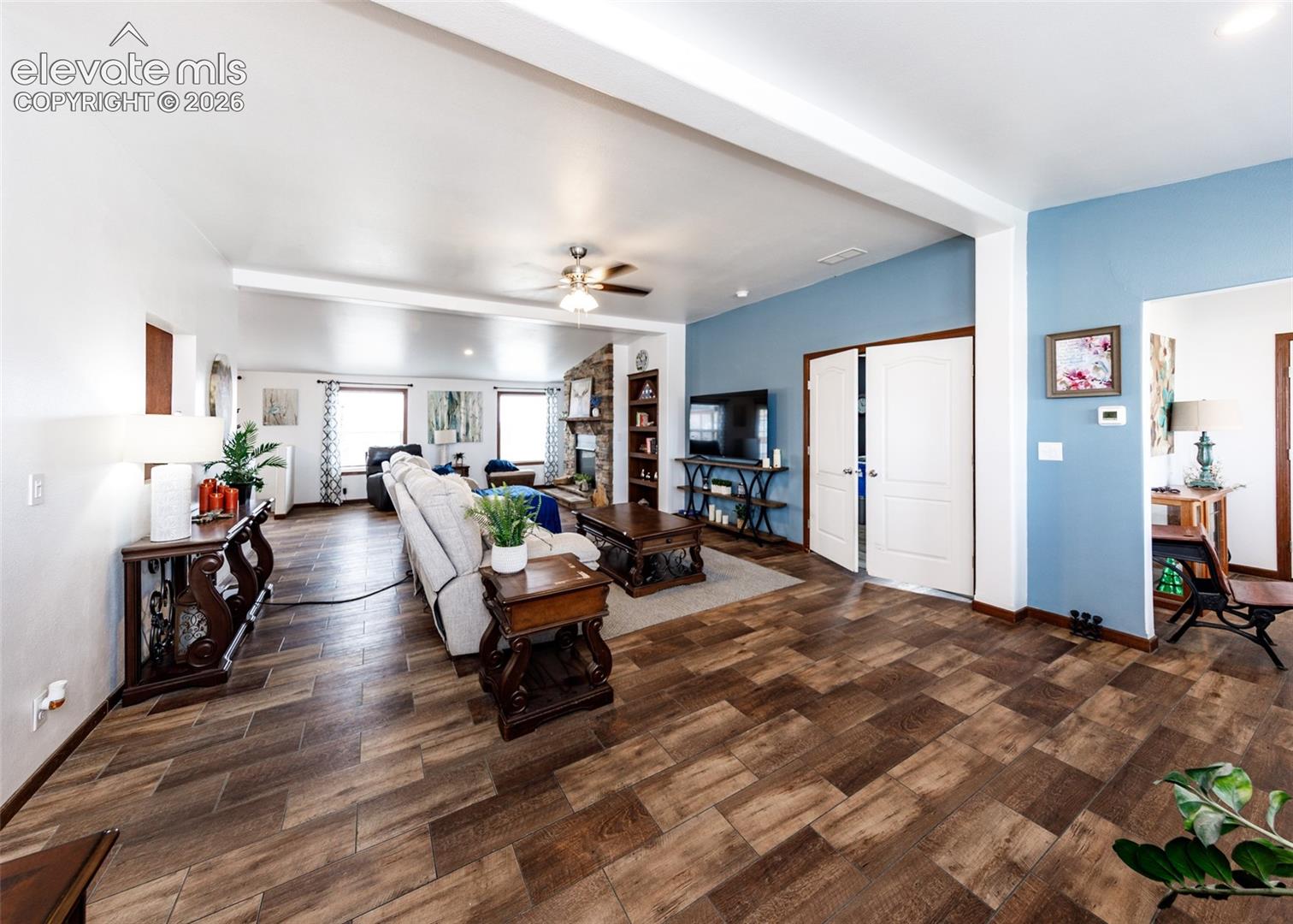 Living room area that leads into the master bedroom
