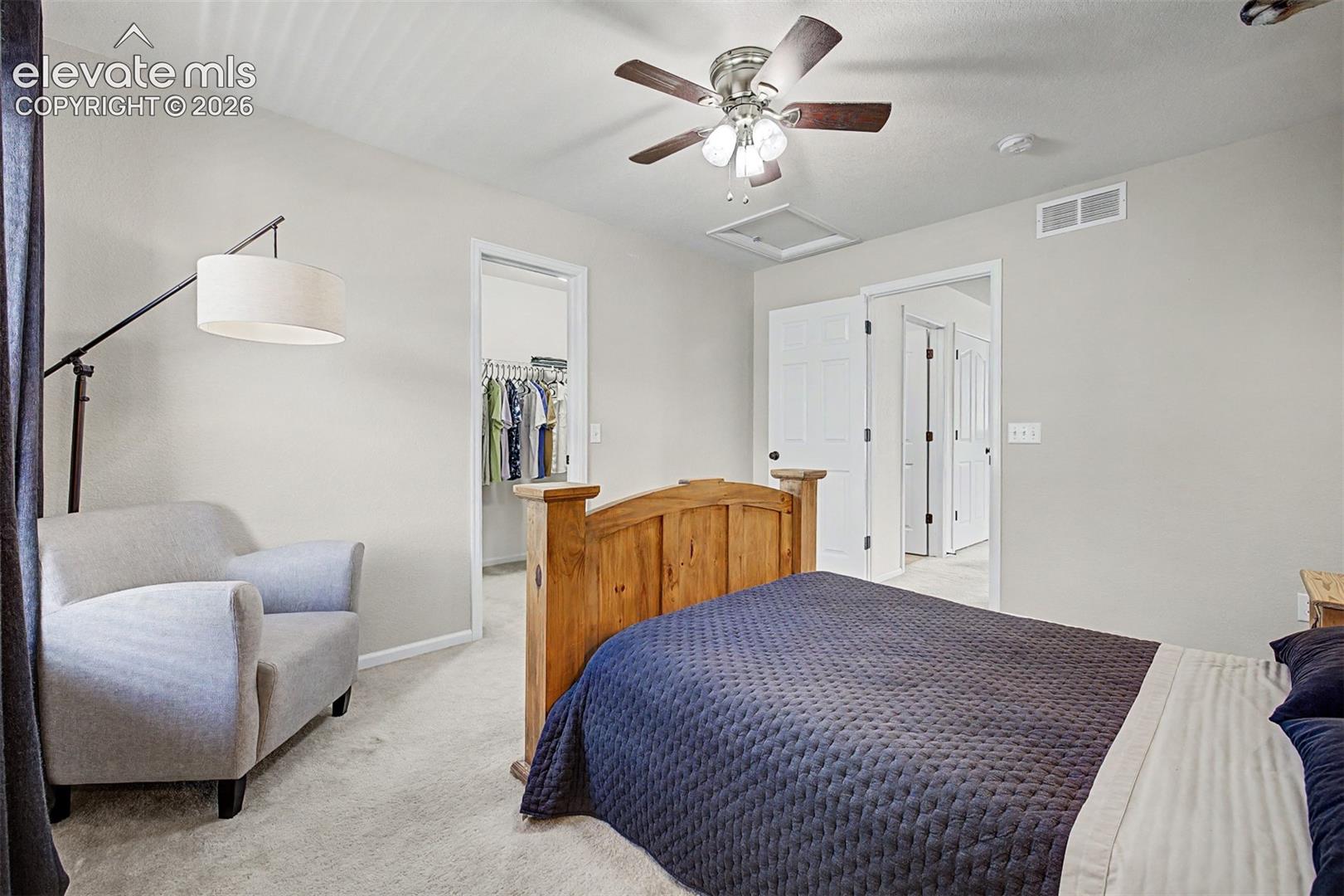 A bright window nook creates a natural reading or relaxation corner in this bedroom, showing how the home's thoughtful layout lends itself to both function and comfort.