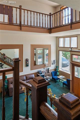 Living area featuring a towering ceiling
