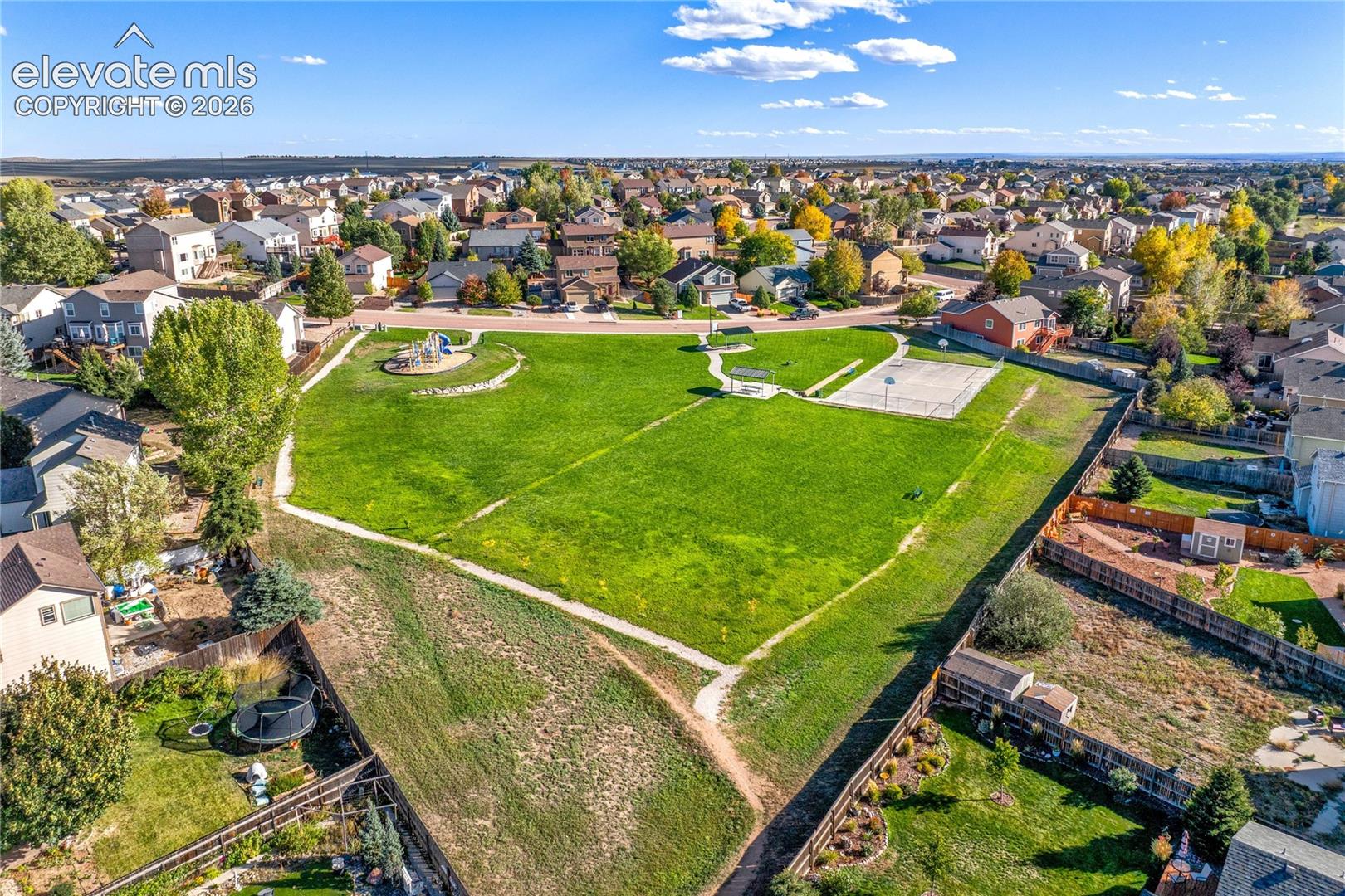 Nearby neighborhood park features an expansive grassy field, paved walking paths + recreational areas, adding opportunities for outdoor enjoyment close to home.