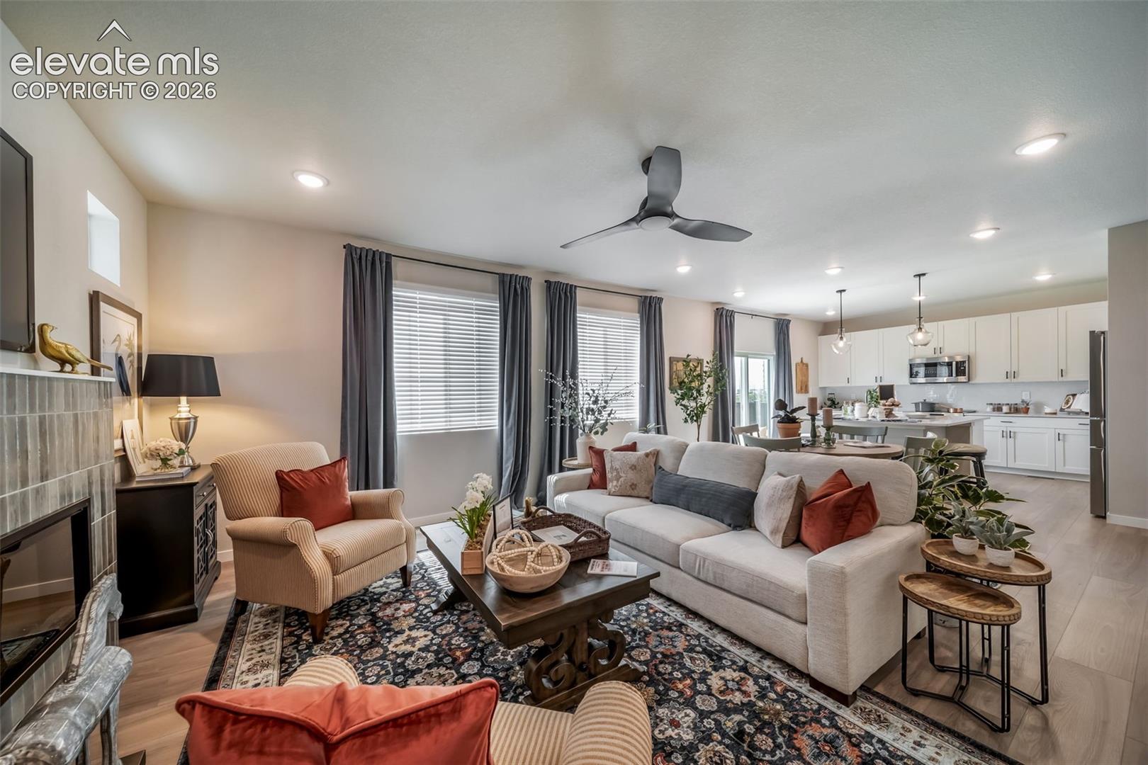 Open-concept living area featuring light wood-finish flooring throughout
*Photos of a model home*