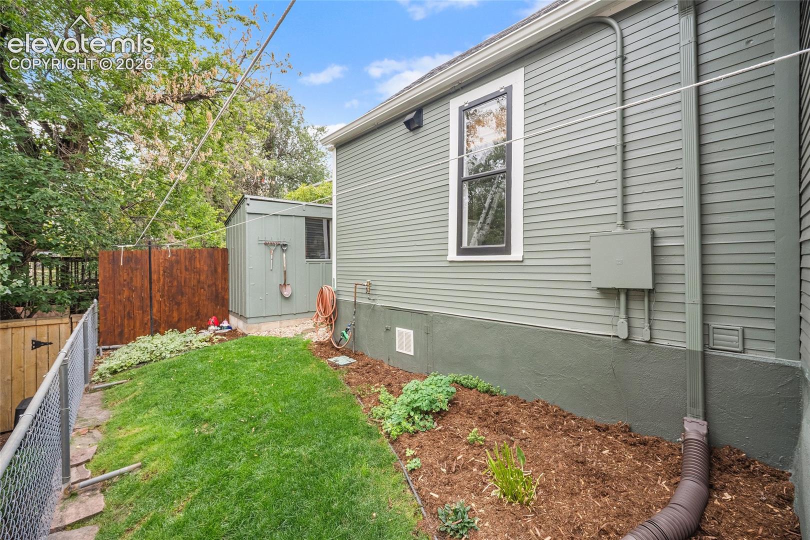Side yard with clothesline