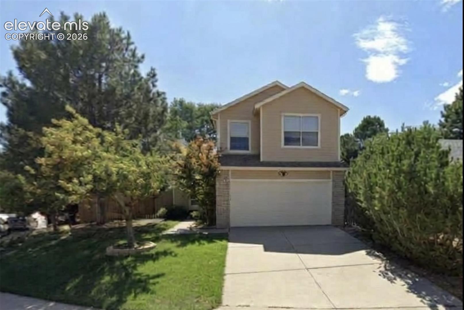 Welcome home to this versatile 4 bedroom 3.5 bathroom West Side retreat, situated on an expansive corner lot just a two-block stroll from Pinon Valley Park and the south entrance of Ute Valley Park. This home beautifully blends modern functionality with exceptional multi-generational or income-generating potential. The main level welcomes you with dramatic two-story vaulted ceilings entering the  living room, anchored by a unique convertible fireplace that switches between electric convenience and traditional wood-burning warmth. Brand-new luxury plank flooring spans the  main level. The sun-drenched, updated kitchen features south-facing bay windows, premium quartz countertops, a mosaic tile backsplash, a portable island, and appliances including a gas range with a built-in griddle. Off the dining area, a walkout complete with custom pet door opens directly to a xeriscaped backyard oasis, showcasing a custom expanded stamped concrete patio, automatic drip watering system, and new privacy fence. Upstairs, the private master suite is a relaxing haven with its’ own dedicated ensuite bath and walk-in shower. The fully finished basement apartment offers incredible flexibility, featuring its own private entrance, 1 bed 1 bath and a fully equipped kitchenette with dining area off the living room with built in office desk area—perfect for extended family or rental income. Hobbyists will love the insulated, sheet-rocked 2-car garage, completely tool-ready with built-in shelving, a pegboard, and a ceiling-mounted storage rack. Added features of the home include, it has central AC and features a new roof (2025), and radon mitigation system (2022).  A rare West Side gem that has been meticulously cared for—see it today before it's gone!