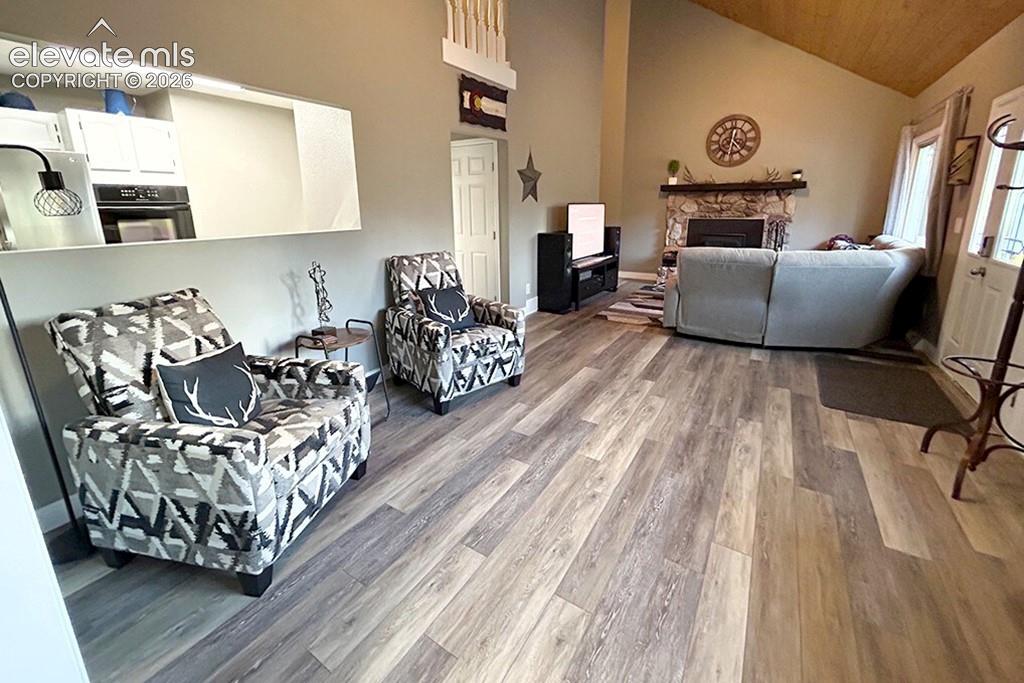 Open concept, looking at door to deck, kitchen, family room