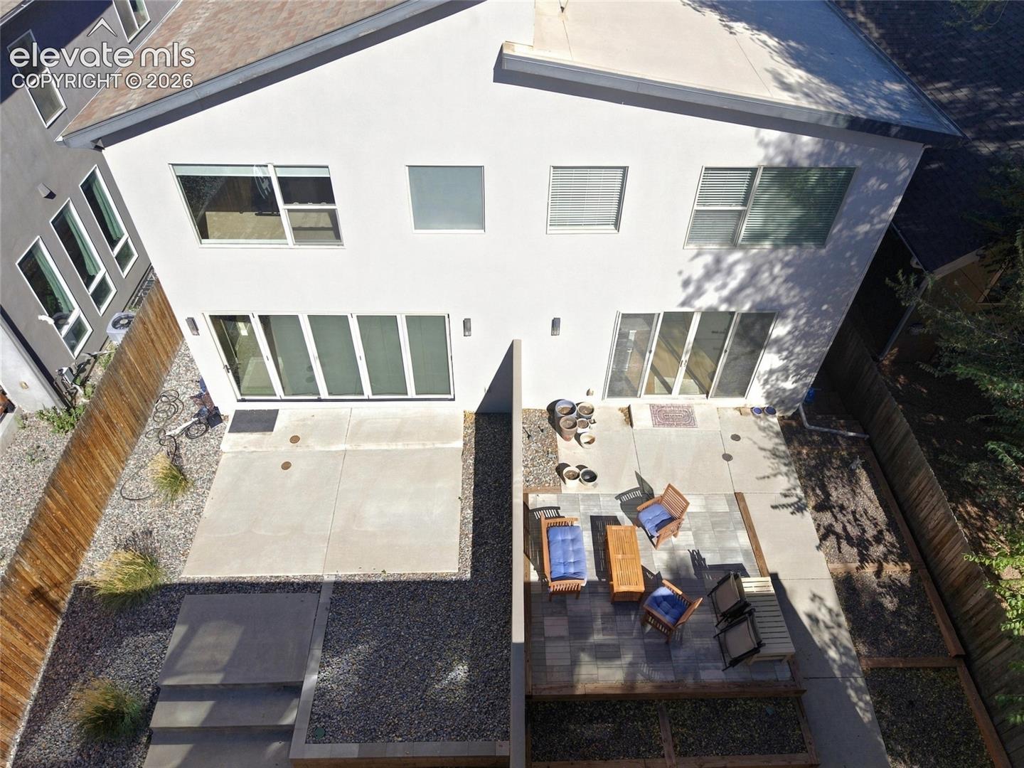 private fenced in back patio with nice hardscape and landscaping. Access to 2 car detached garage
