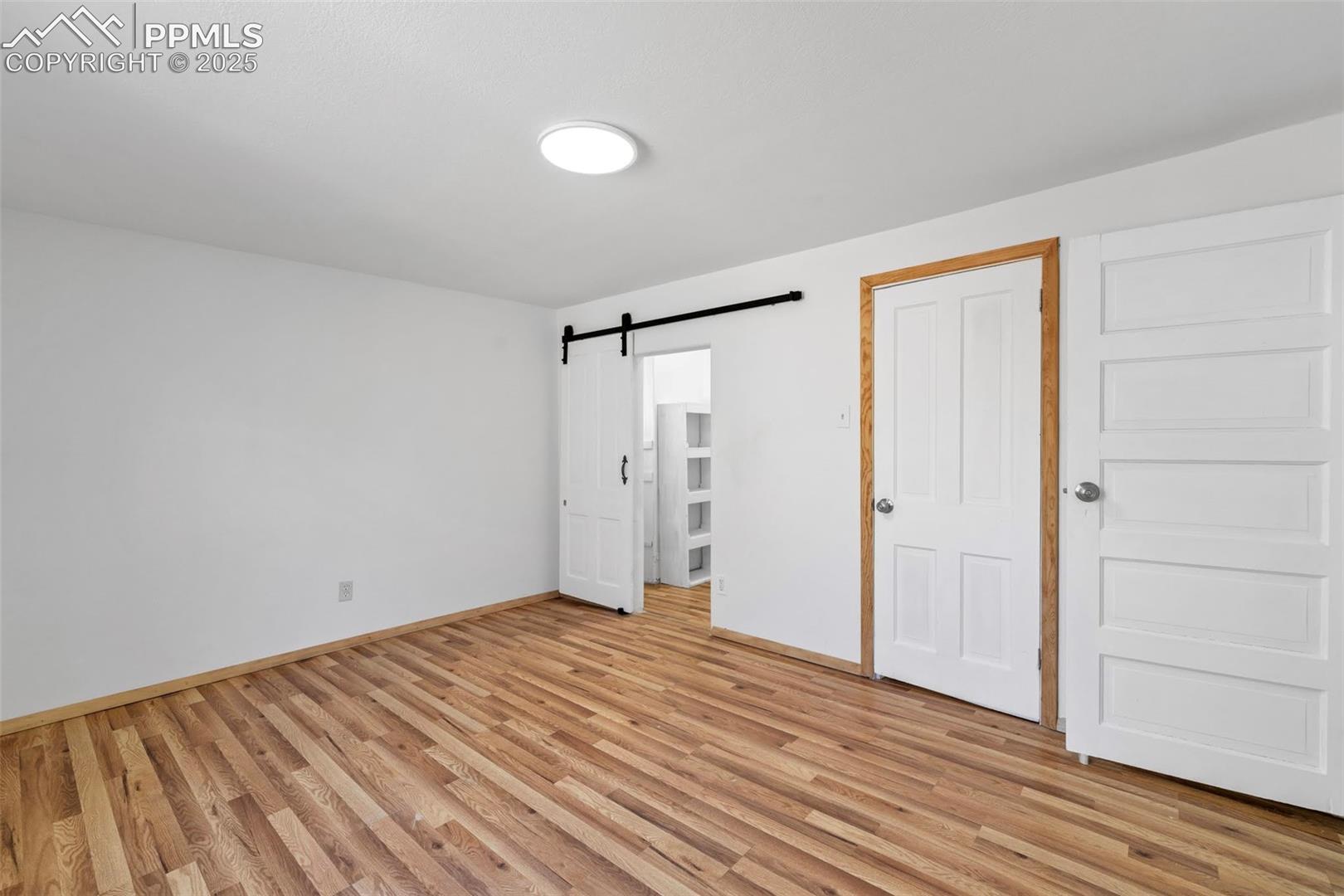 Primary Bedroom with walk-in closet with window