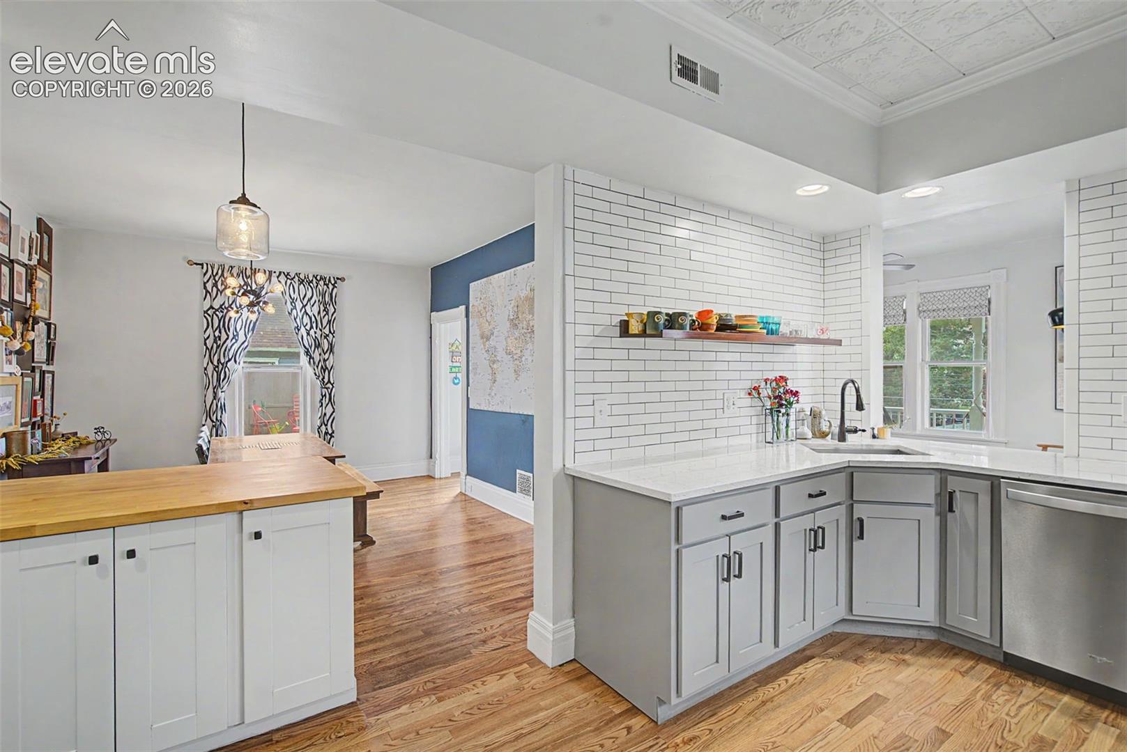 Kitchen to dining room open floor concept emphasizing an open and inviting space.