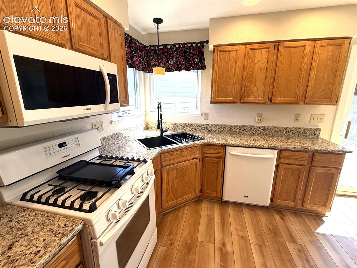 Newer kitchen appliances including gas range/oven