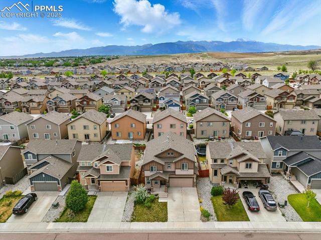 Aerial perspective of suburban area with mountains