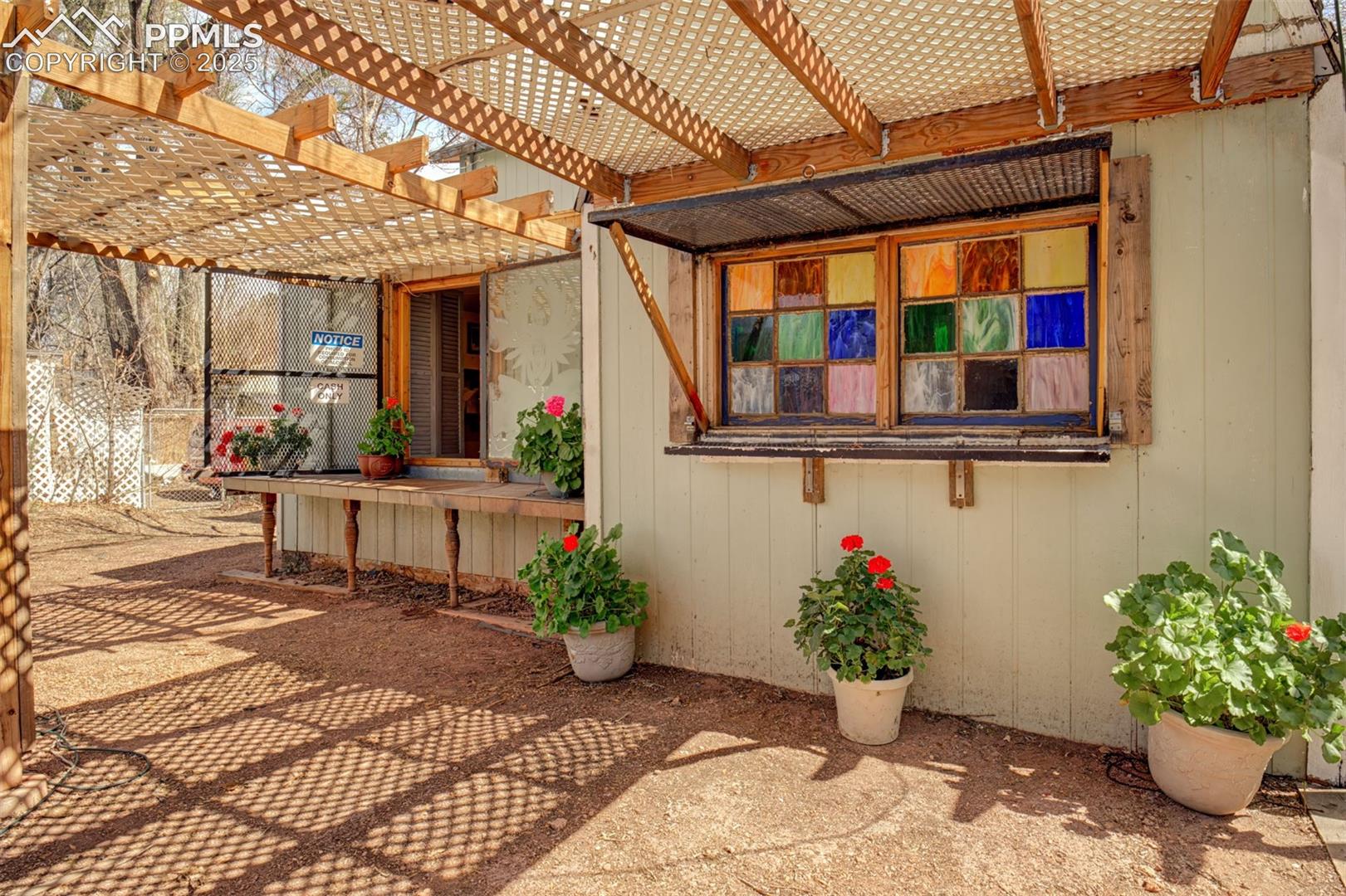 Secret Garden: Bar Hut -One stained glass window, one sand blasted with beautiful designs