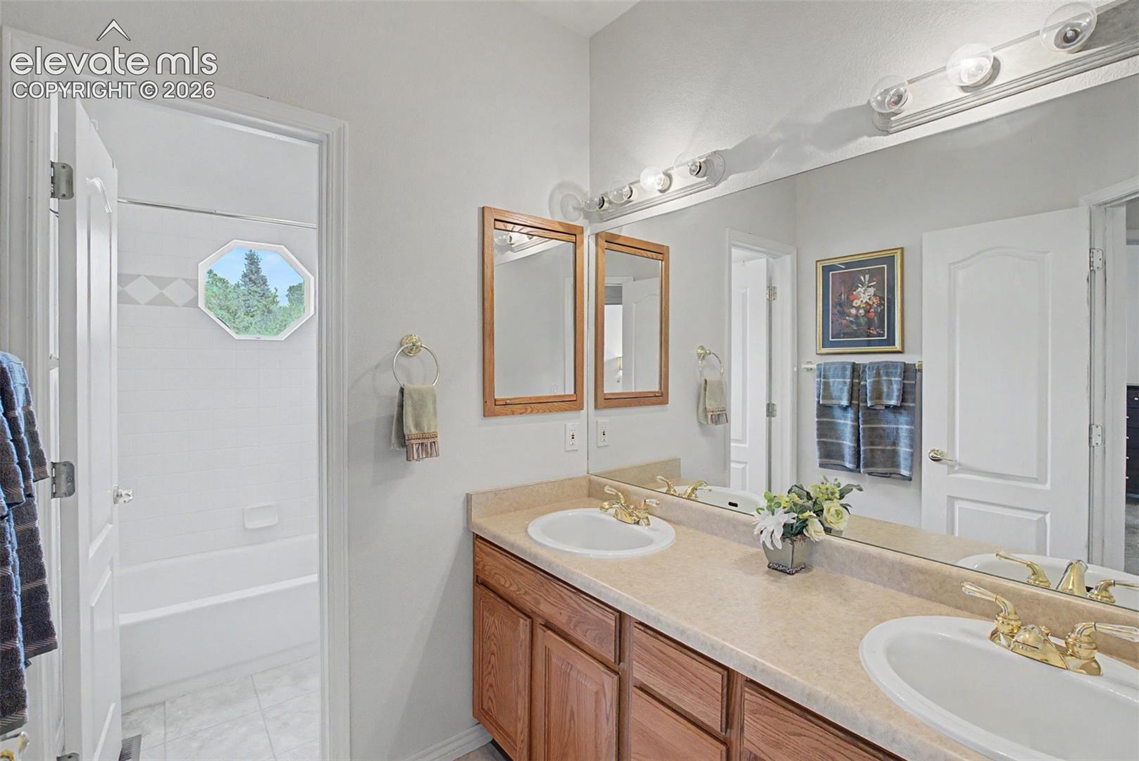 Upstairs Full Bathroom with Dual Vanity and Split Layout!
