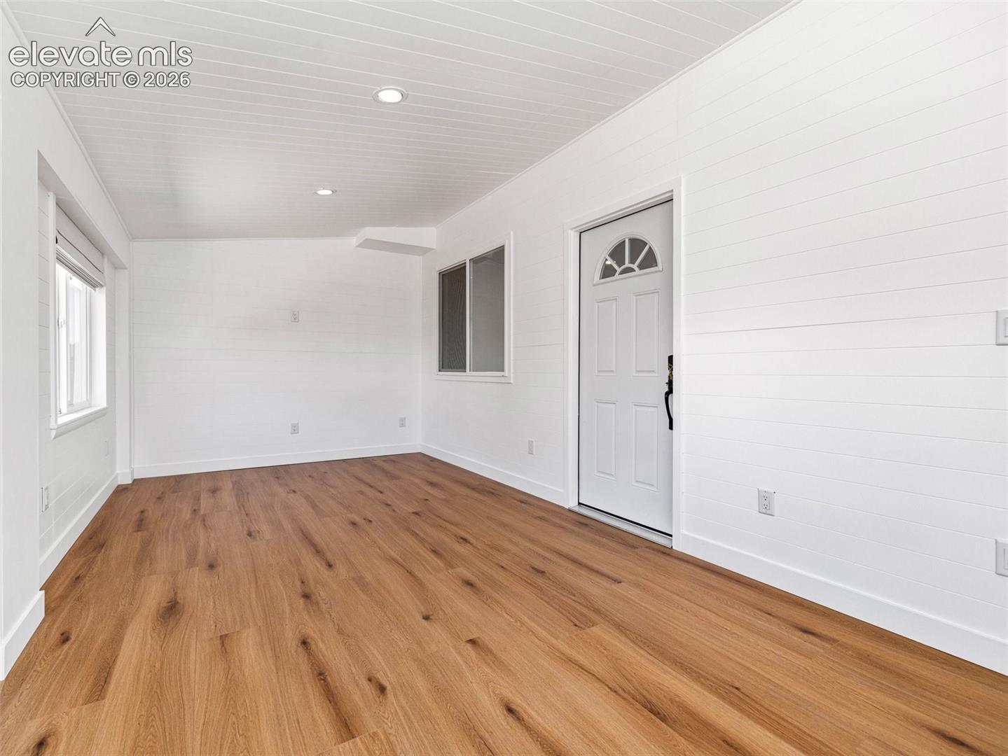The enclosed porch to the ADU offers additional living space, if desired