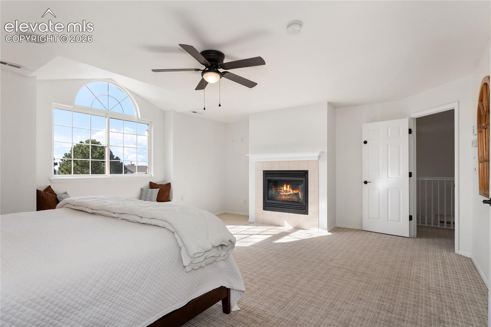 primary bedroom features a gas fireplace