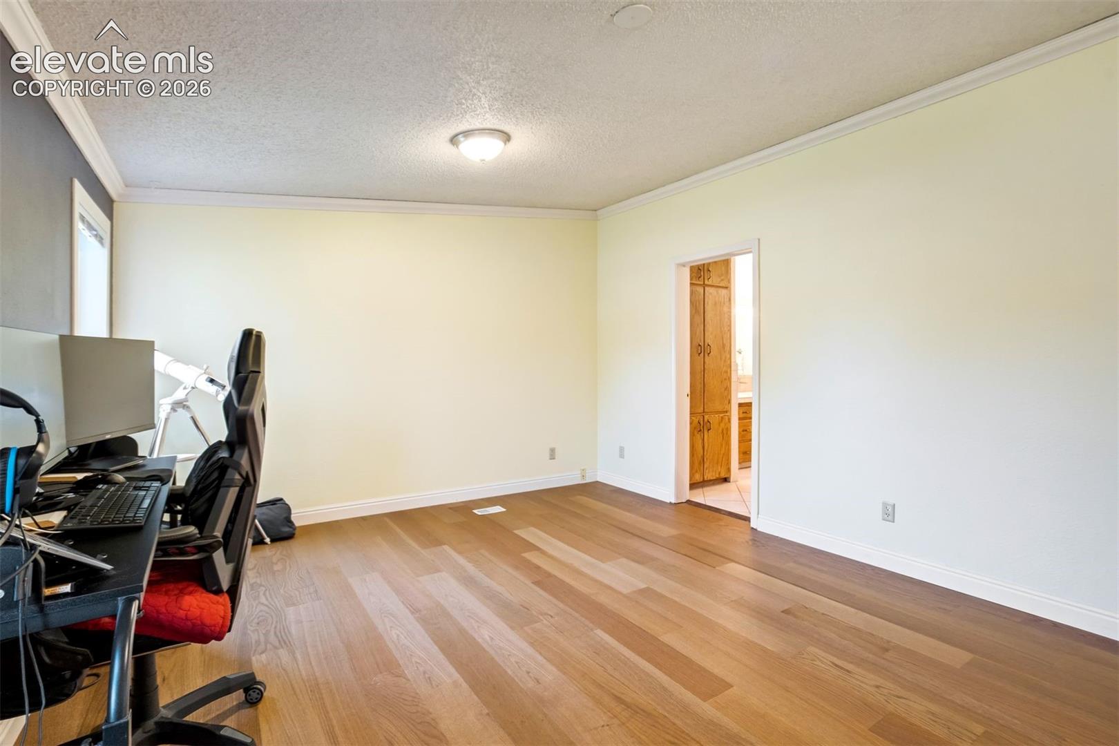 Primary suite offers direct access to the adjoining bathroom.