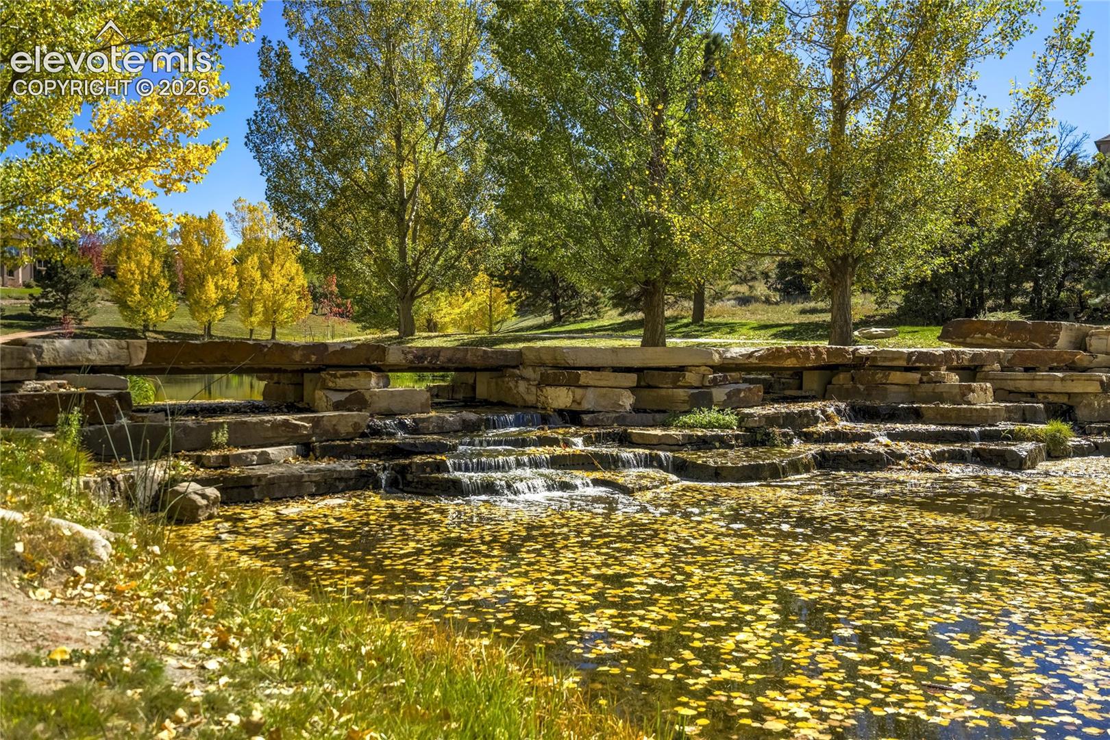 Stone Crossing's flowing water features, stone terraces + mature trees complement an inspired Colorado lifestyle, with La Foret trails, Mary Kyer Park, District 20 schools + Northgate/InterQuest amenities nearby.
