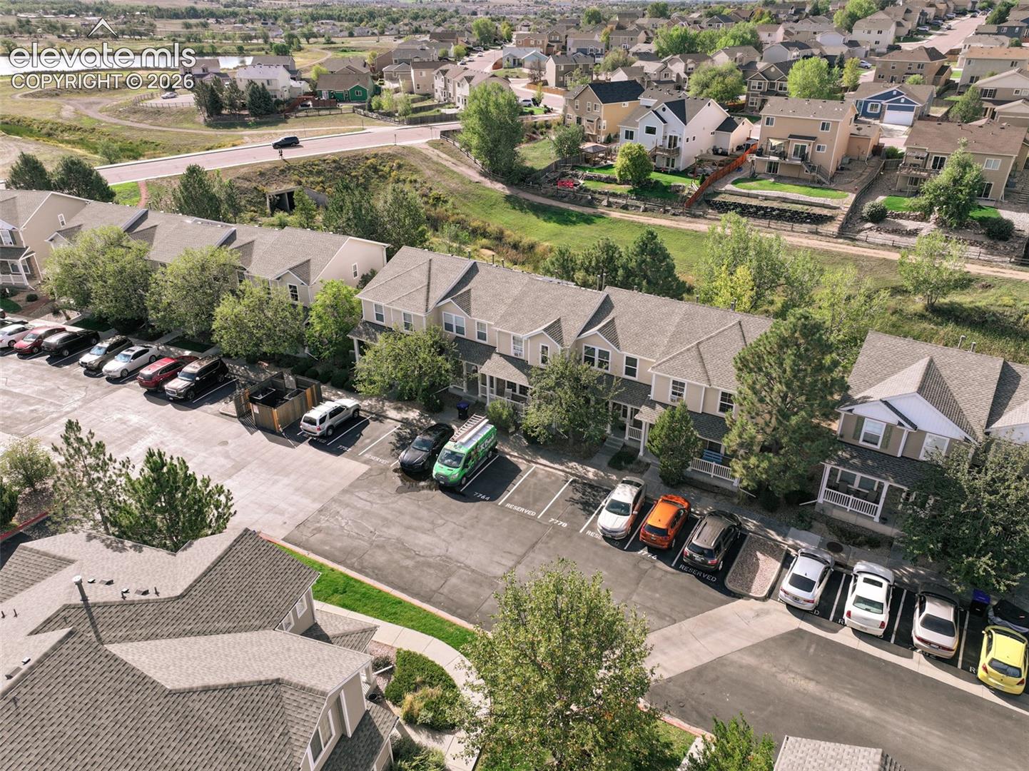 front aerial view with designated parking spots