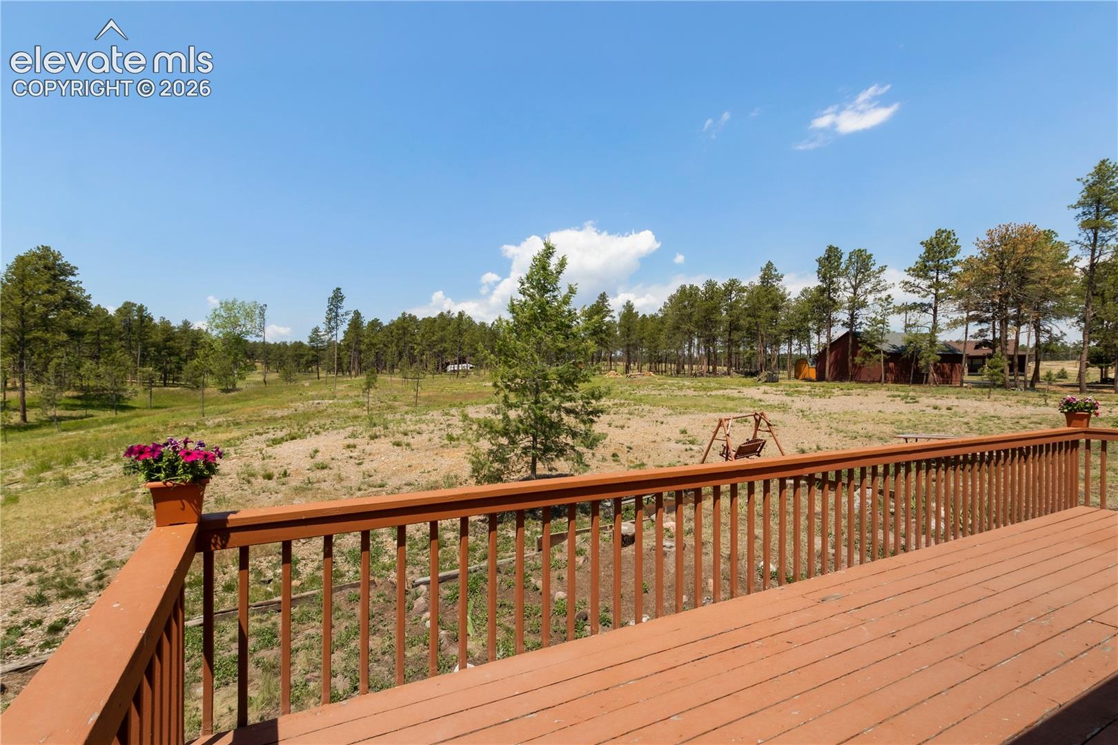 Deck off the living room, looking west at the 5 acres